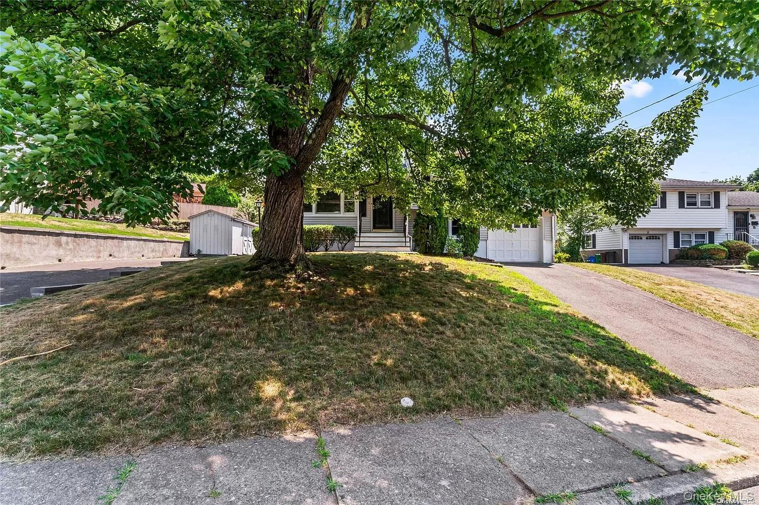6 Valley View Terrace Suffern, NY 10901 - Photo 2 of 19 a view of a yard with plants and large trees