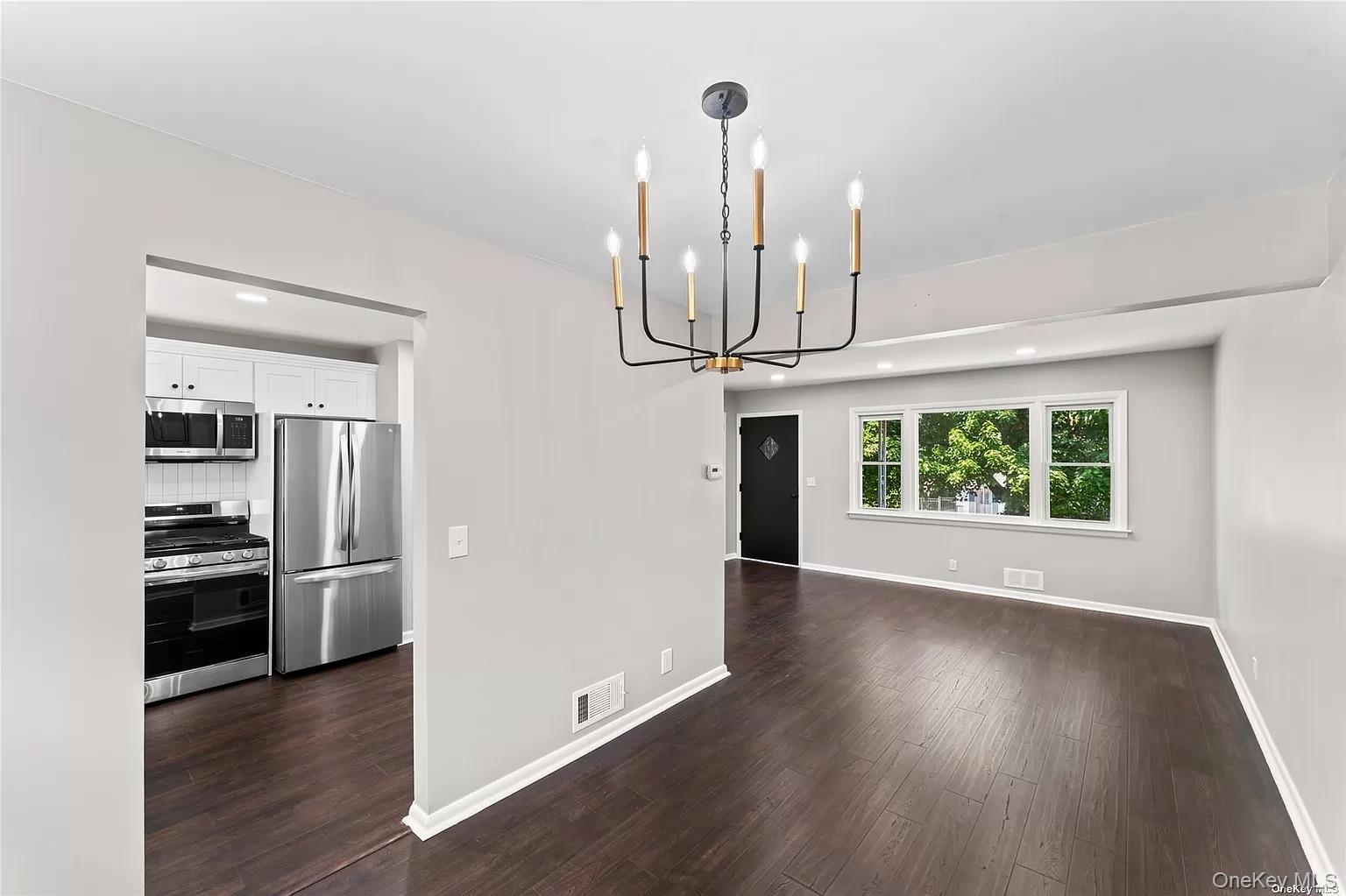 6 Valley View Terrace Suffern, NY 10901 - Photo 3 of 19 a view of empty room with wooden floor and fireplace