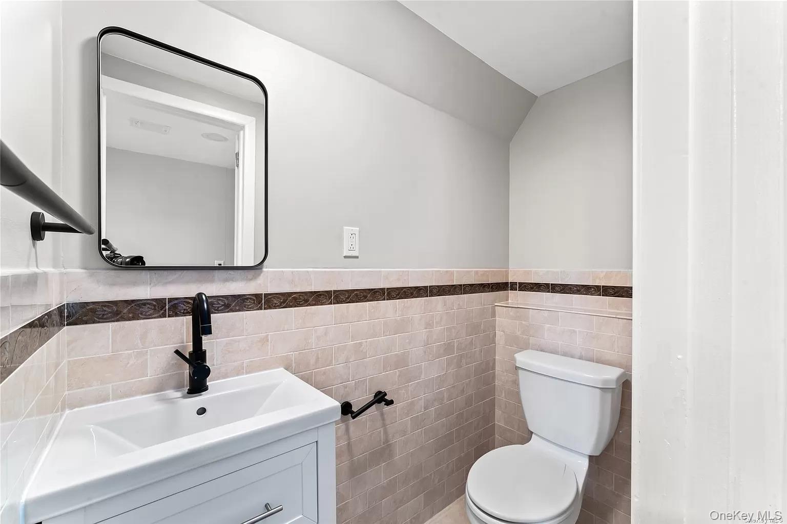 6 Valley View Terrace Suffern, NY 10901 - Photo 7 of 19 a bathroom with a toilet sink and mirror