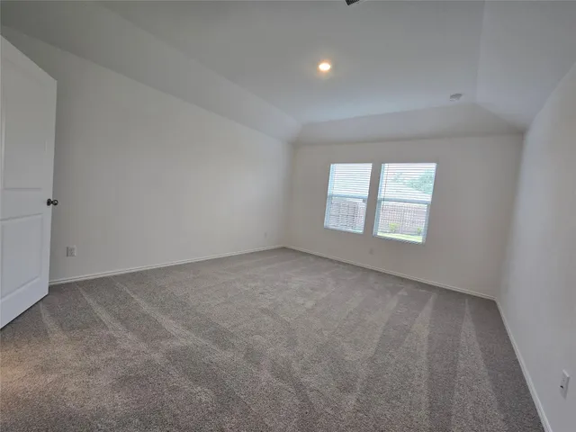 a view of a kitchen with a sink and a refrigerator