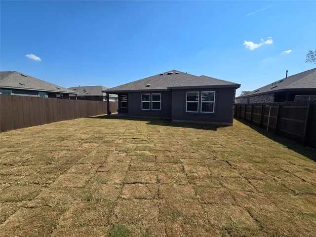 a view of swimming pool with a yard