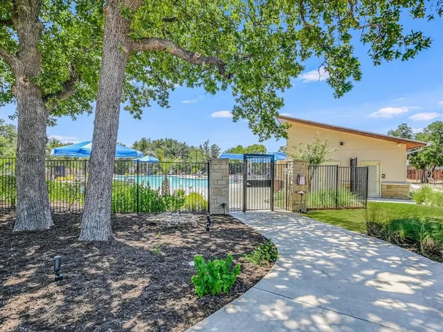 a view of a park with swings and slides