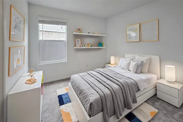 a bedroom with bed and a window