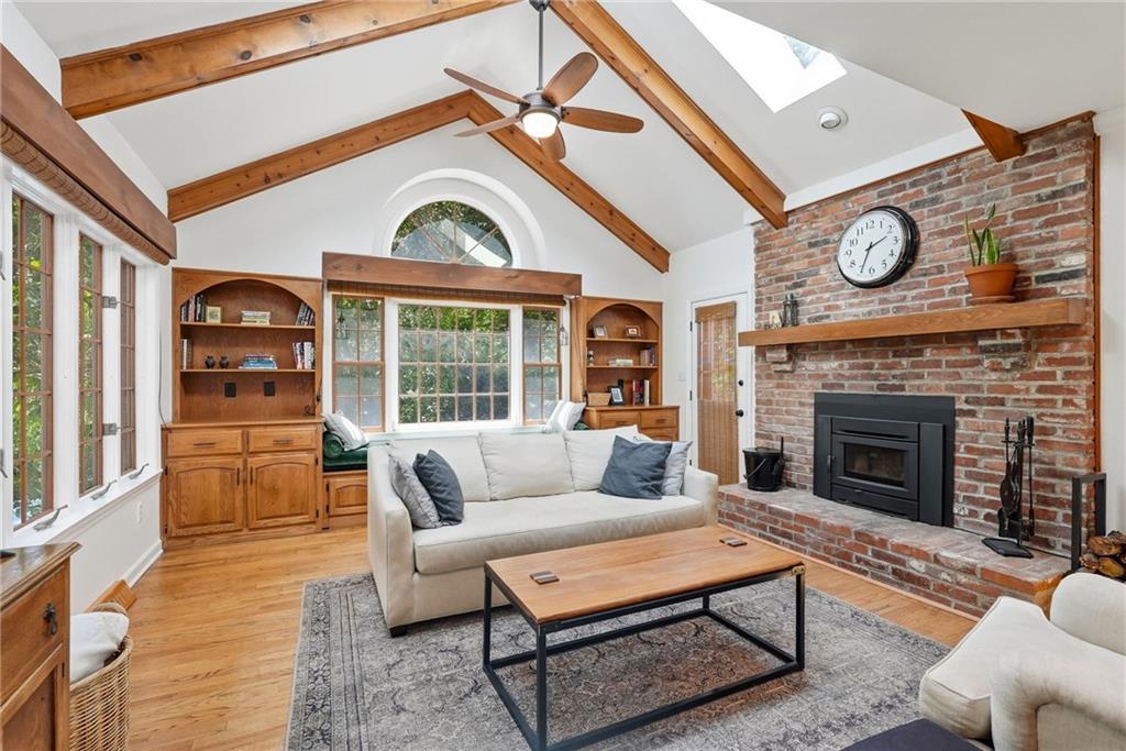 900 Settlers Ridge Road Pittsburgh, PA 15238 - Photo 9 of 50 The heart of the home, this inviting family room features a vaulted ceiling with exposed beams, skylights, hardwood floors, and seamless access to the upper patio.