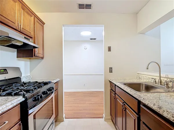 a kitchen with a stove and a sink