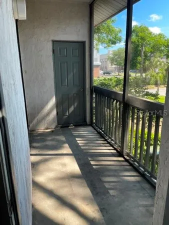 a view of a balcony with door