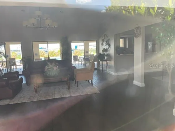 a living room with couches and painted walls next to a window