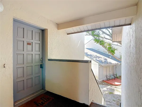 a view of a hallway with windows