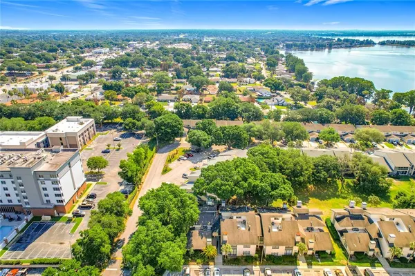 an aerial view of ocean and residential houses with outdoor space and lake view