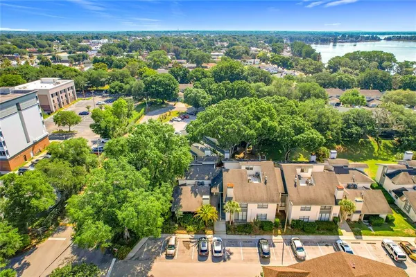 an aerial view of a house with garden space and street view