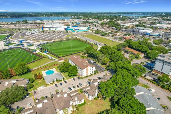 an aerial view of a houses with outdoor space and lake view