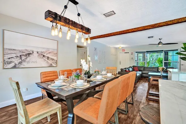 a dining room with furniture and window