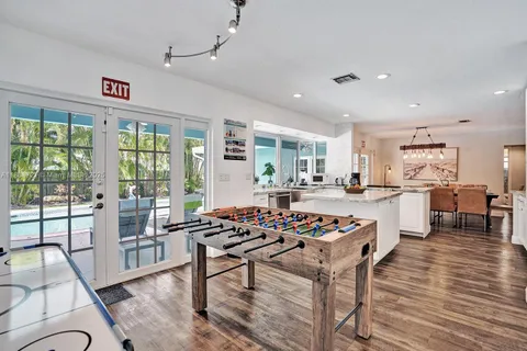 a very nice looking living room with a large dining table and a large window