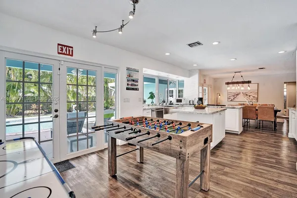 a very nice looking living room with a large dining table and a large window