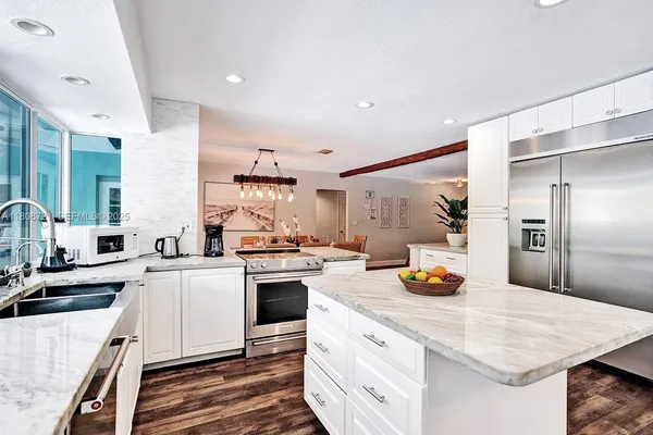 a kitchen with a sink a stove and refrigerator