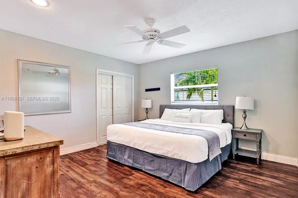 a bedroom with a bed and a table