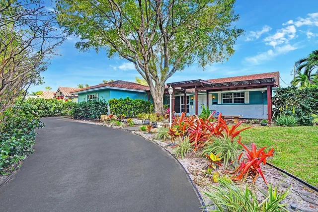 front view of a house with a big yard