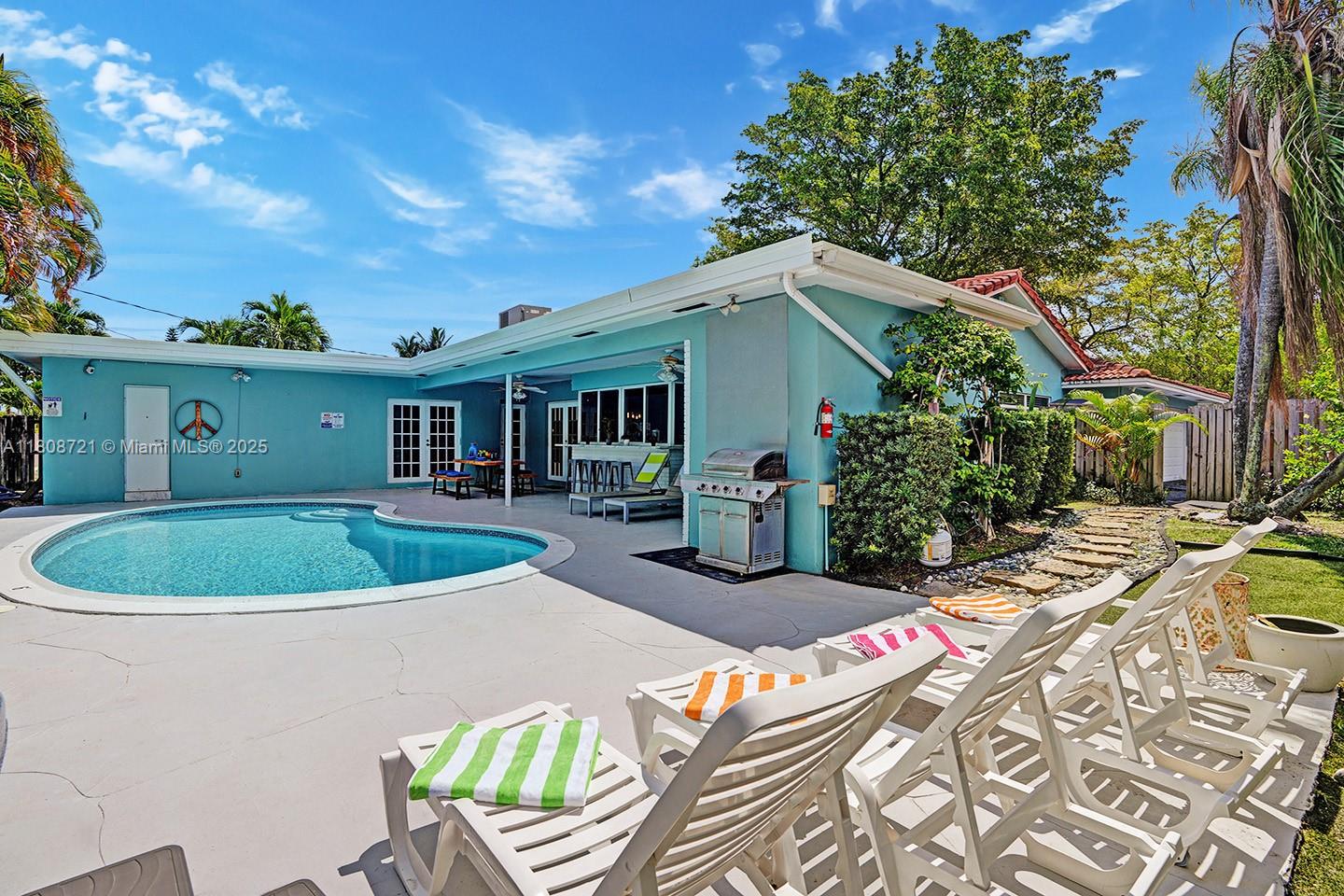 1245 Wiley Street Hollywood, FL 33019 - Photo 40 of 43 a view of a house with backyard and sitting area