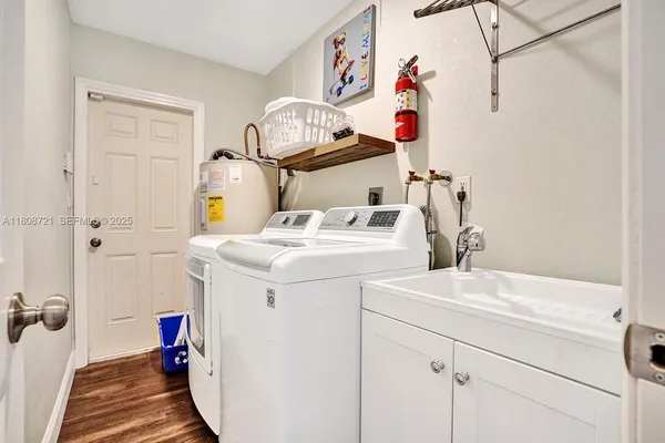 a utility room with dryer and washer