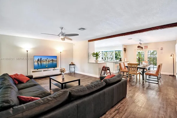 a living room with furniture and a flat screen tv