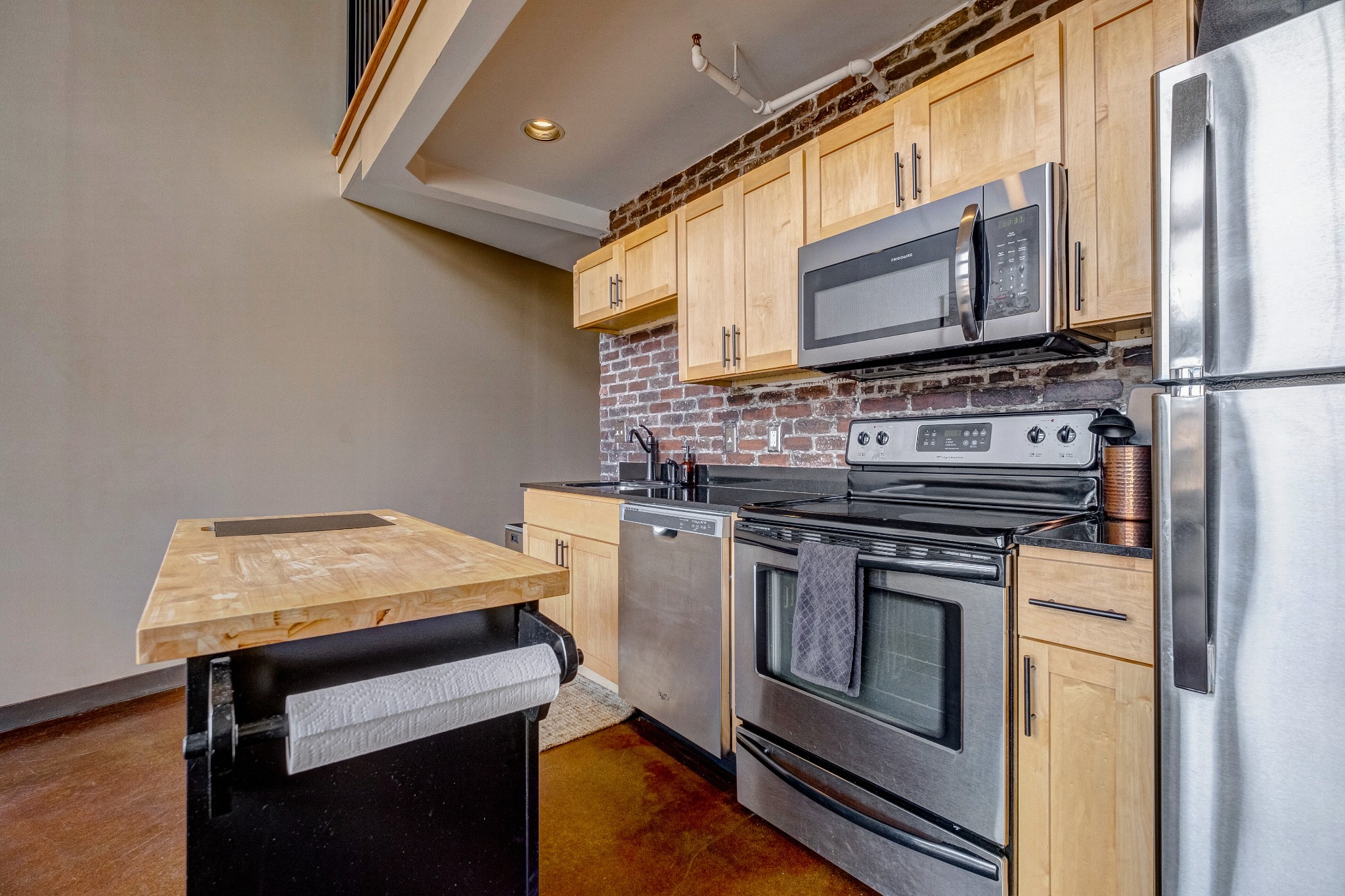 1400 Rosa L Parks Boulevard, Unit 320 Nashville, TN 37208 - Photo 15 of 34 a kitchen with a stove and a microwave
