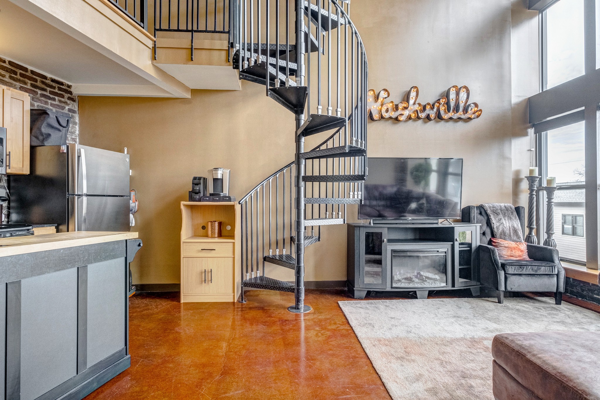 1400 Rosa L Parks Boulevard, Unit 320 Nashville, TN 37208 - Photo 20 of 34 a view of a kitchen with furniture and electronic appliances
