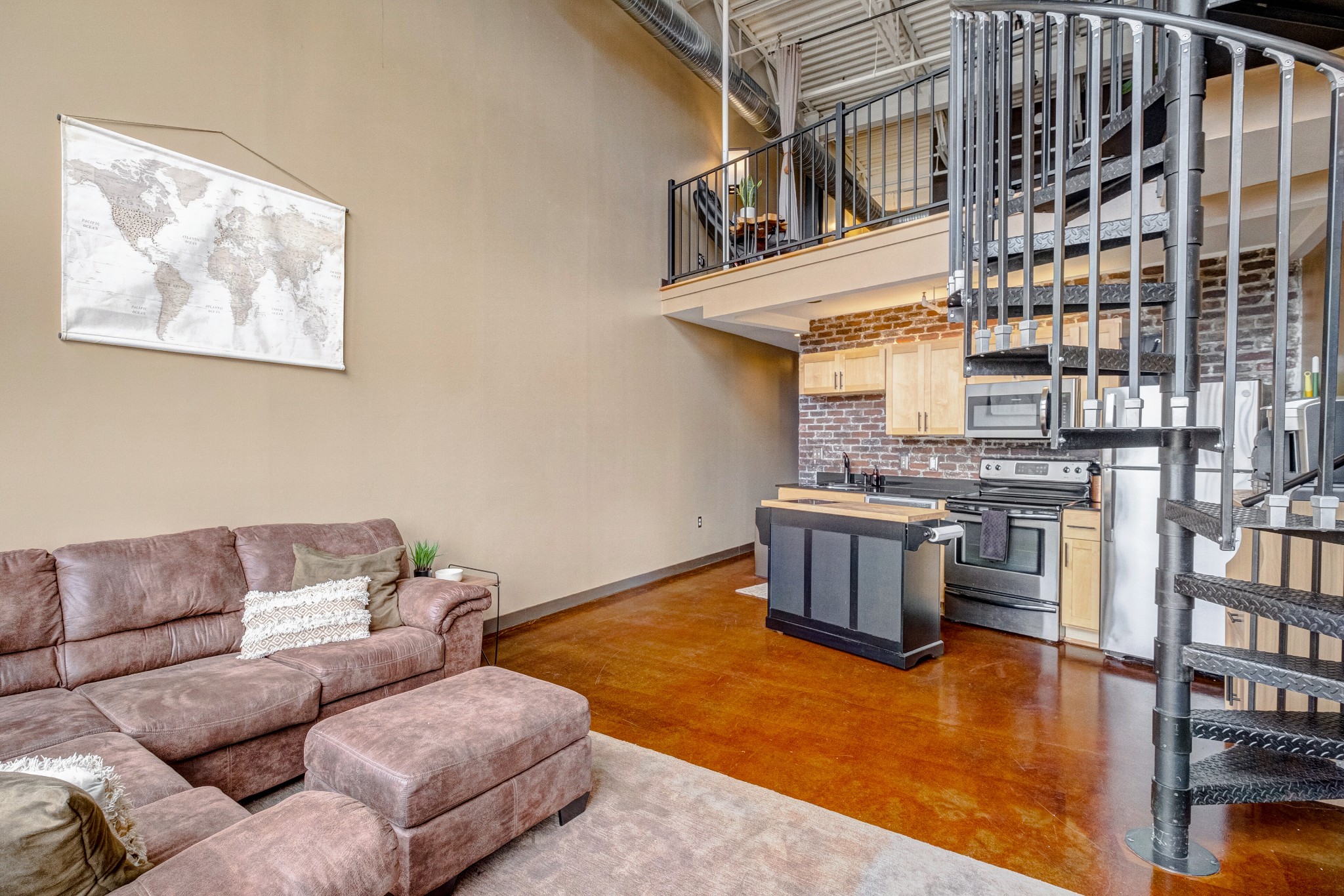 1400 Rosa L Parks Boulevard, Unit 320 Nashville, TN 37208 - Photo 7 of 34 a living room with furniture and a kitchen view