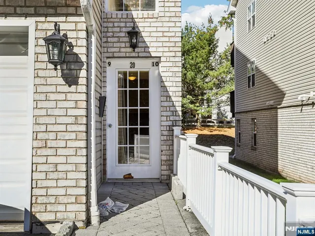 a view of a balcony with wooden floor and fence