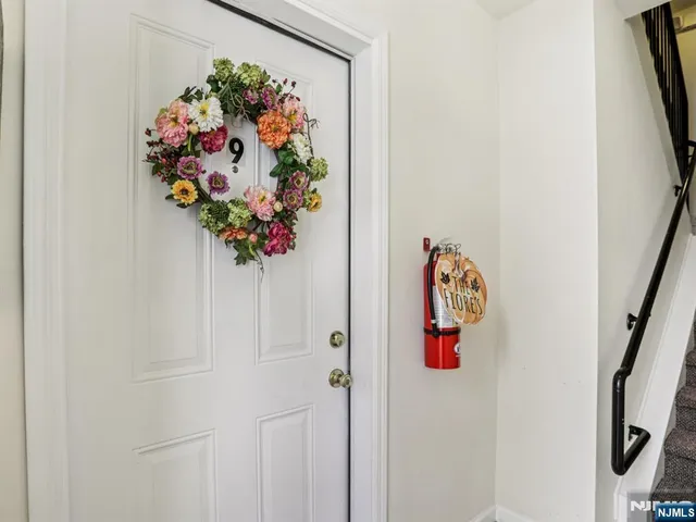 a vase of flowers sitting on a floor