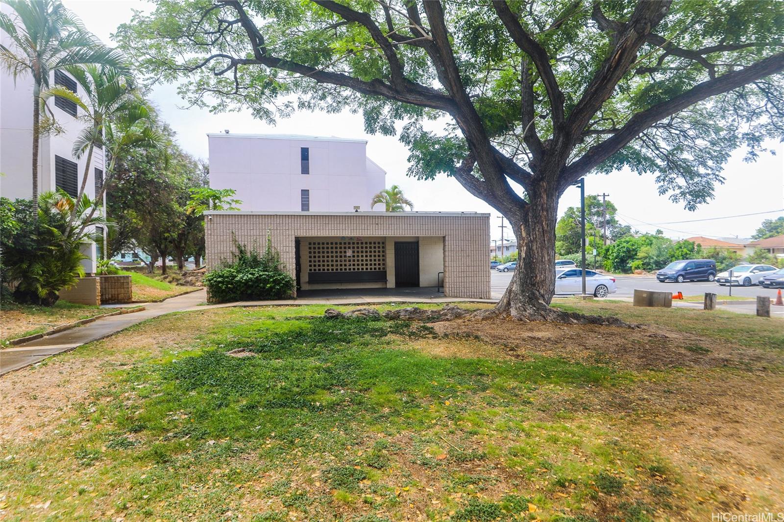 87-122 Helelua Street, Unit C204 Waianae, HI 96792 - Photo 16 of 19 a view of a house with backyard and a tree