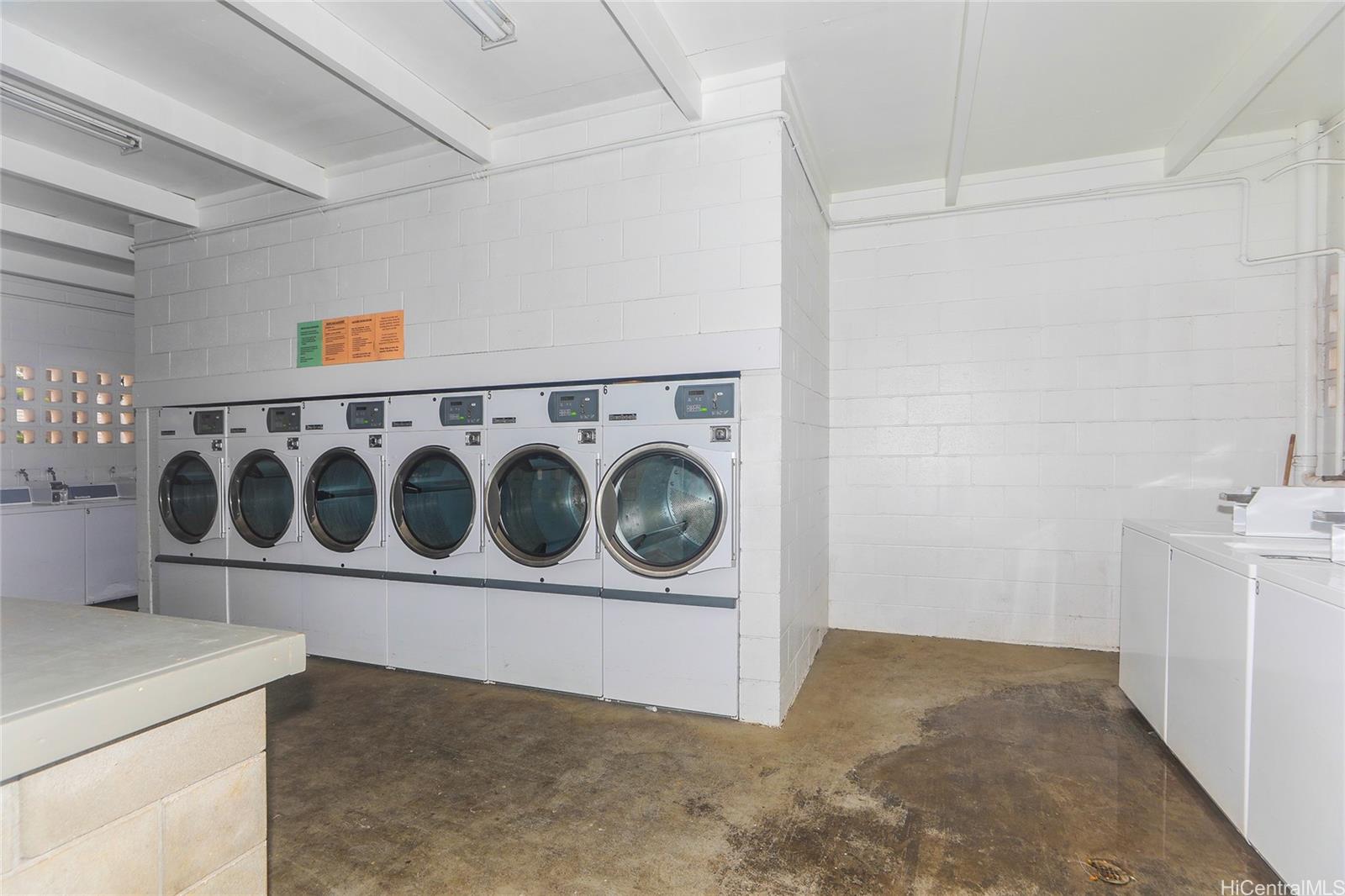 87-122 Helelua Street, Unit C204 Waianae, HI 96792 - Photo 18 of 19 a utility room with dryer and washer