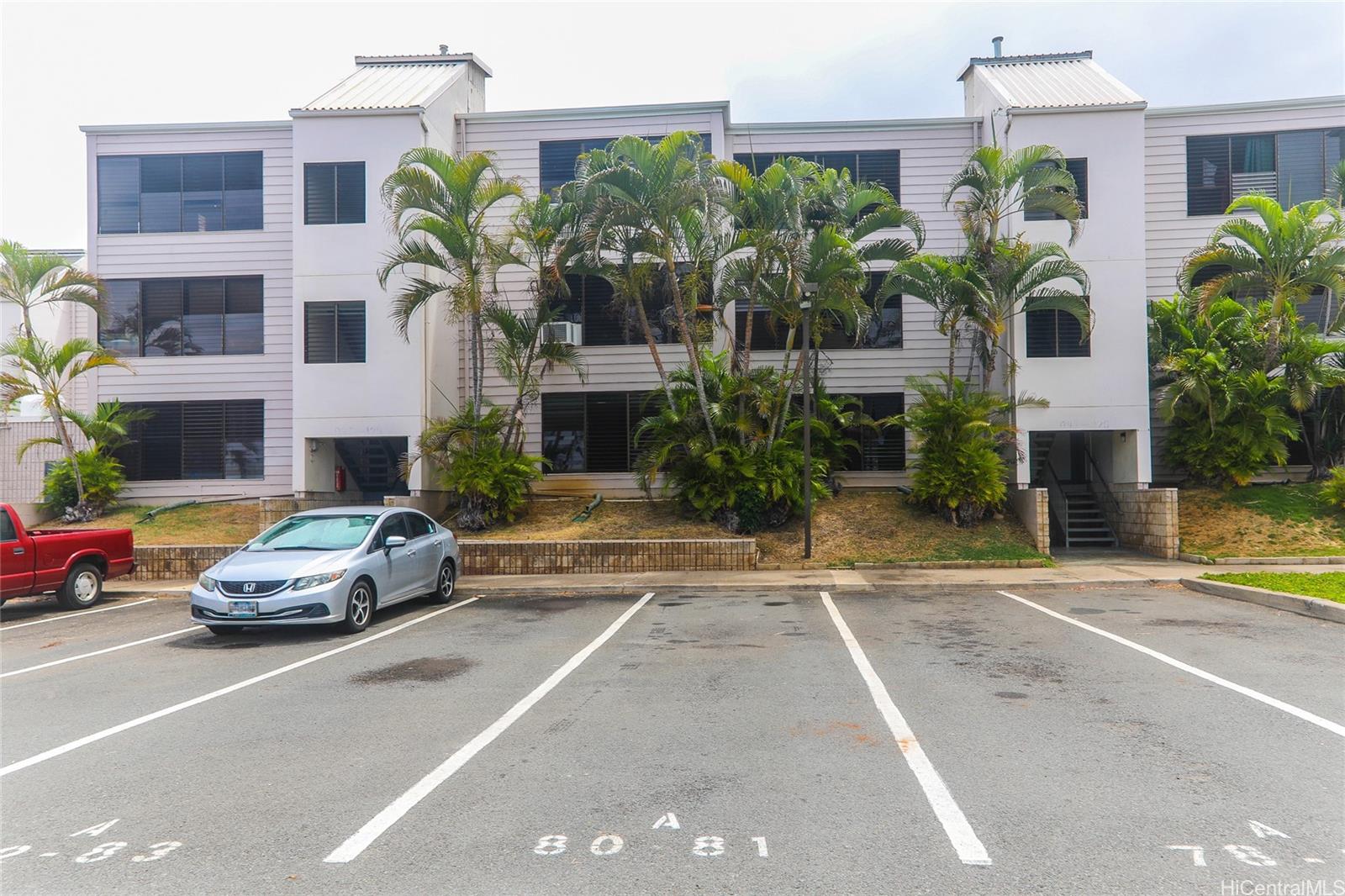 87-122 Helelua Street, Unit C204 Waianae, HI 96792 - Photo 19 of 19 a car parked in front of a building