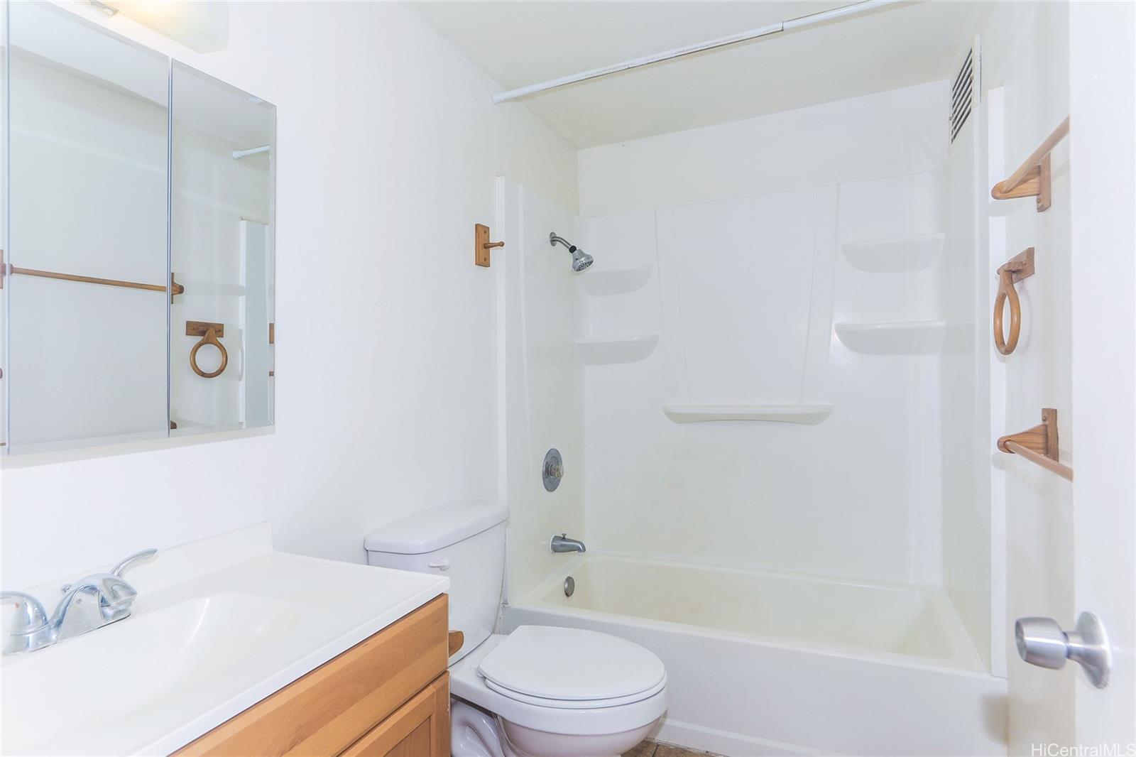 87-122 Helelua Street, Unit C204 Waianae, HI 96792 - Photo 8 of 19 a bathroom with a sink toilet and shower