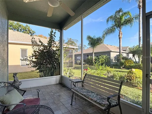a house view with a sitting space and garden