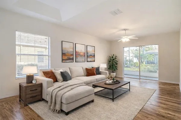 a living room with furniture and a large window