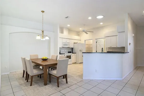a view of a dining room and livingroom with furniture