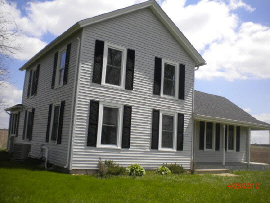 1212 Fisk Road Compton, IL 61318 - Photo 1 of 10 a front view of a house with a yard