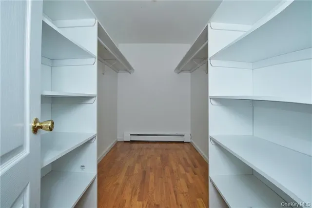 a view of room with wooden floor and staircase