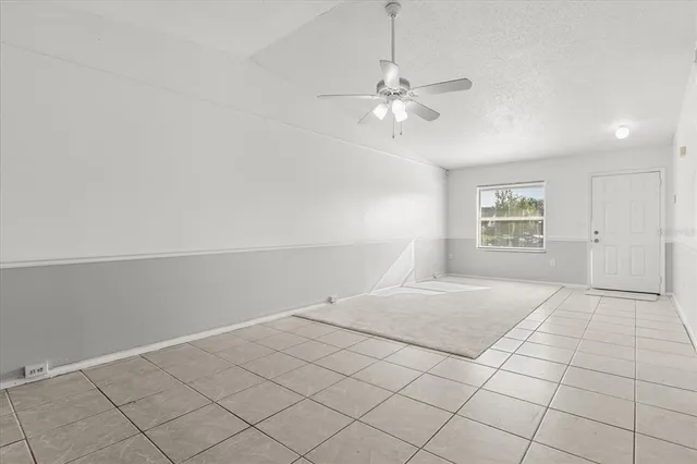 a kitchen with granite countertop a stove and a refrigerator