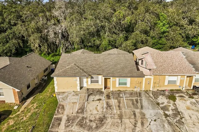 an aerial view of a house with a garden