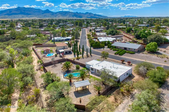 an aerial view of a house with a lake view