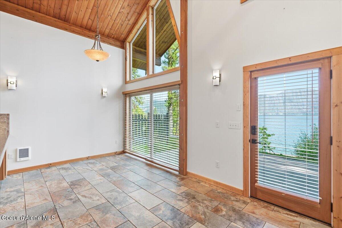 20246 East Cape Horn Road Bayview, ID 83803 - Photo 51 of 104 Patio Door and Dining