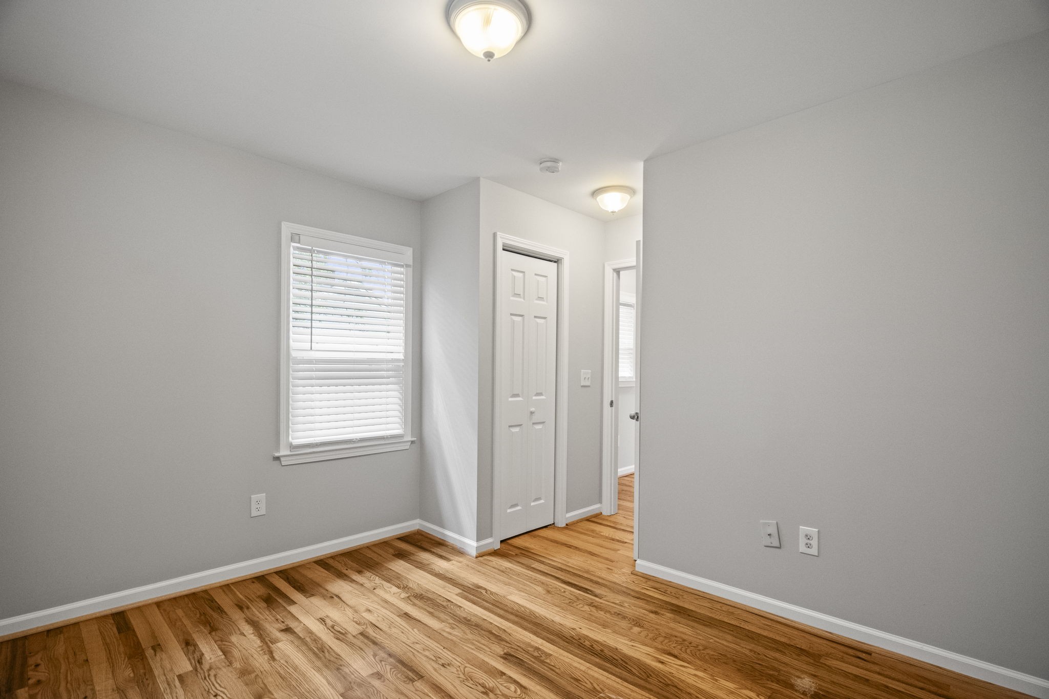 202 Cherokee Road Nashville, TN 37205 - Photo 15 of 35 a view of an empty room with wooden floor and a window