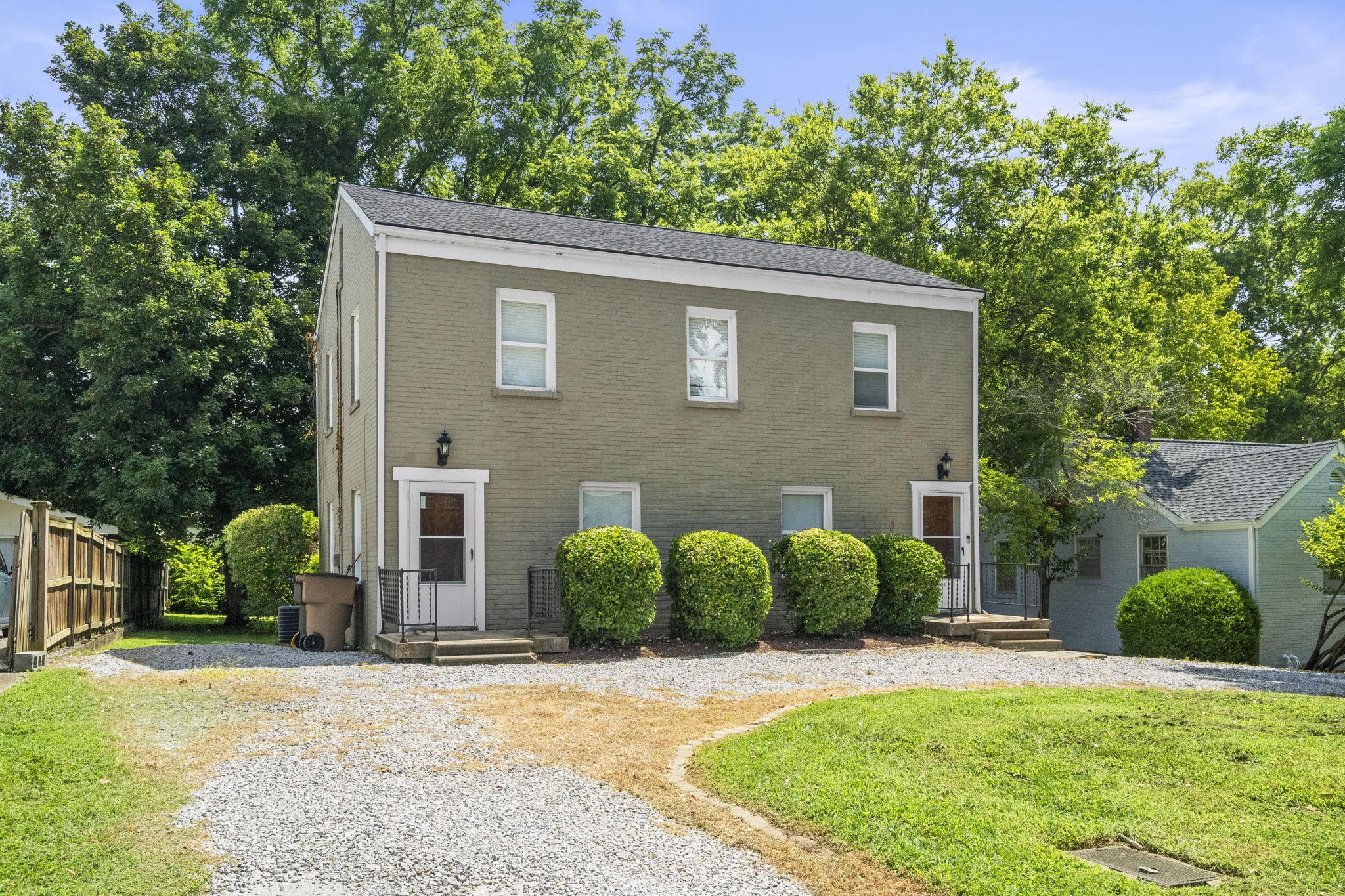 202 Cherokee Road Nashville, TN 37205 - Photo 2 of 35 a view of a house with a yard and plants