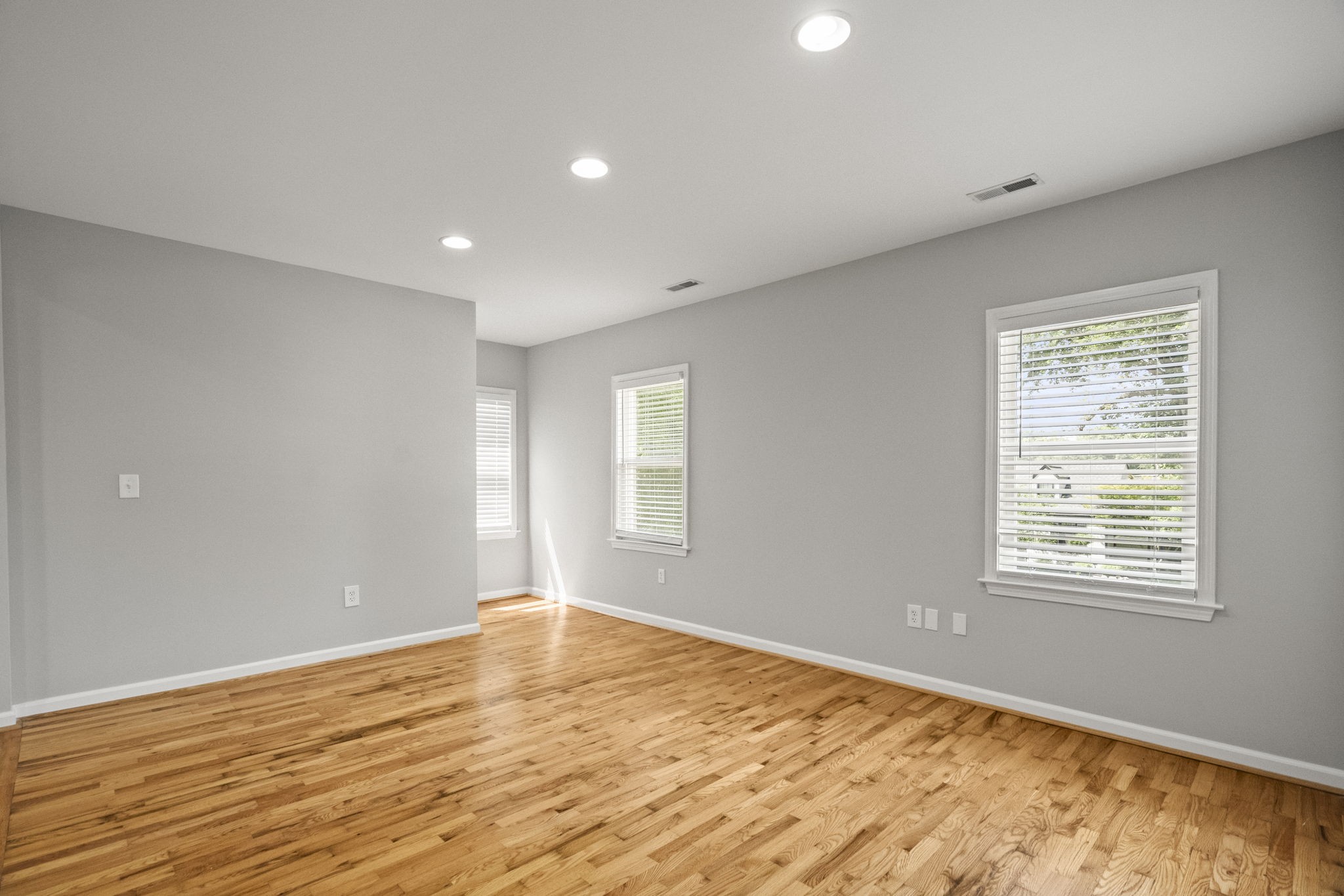 202 Cherokee Road Nashville, TN 37205 - Photo 21 of 35 a view of an empty room with wooden floor and a window