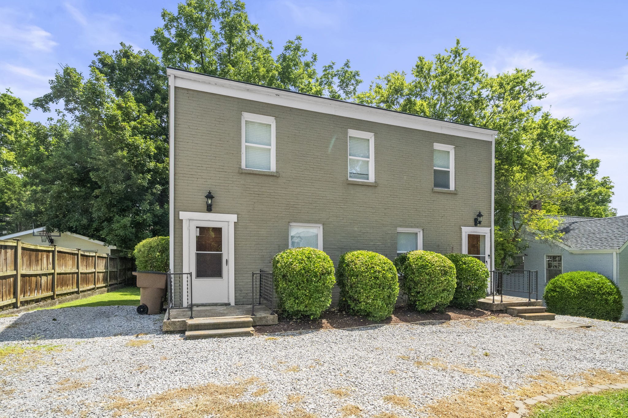 202 Cherokee Road Nashville, TN 37205 - Photo 3 of 35 a view of a house with a yard plants and large tree