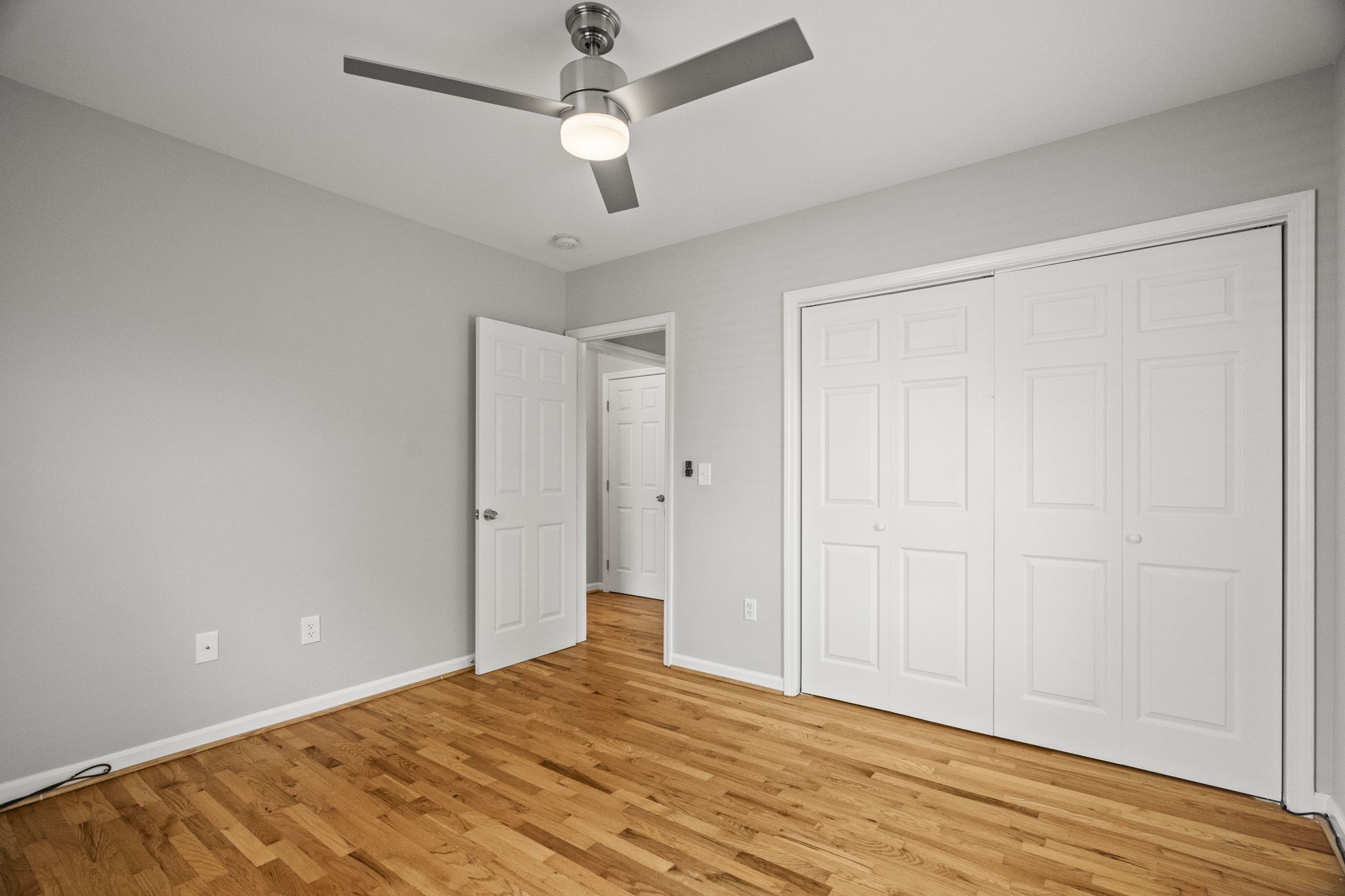 202 Cherokee Road Nashville, TN 37205 - Photo 31 of 35 wooden floor in an empty room with a chandelier fan