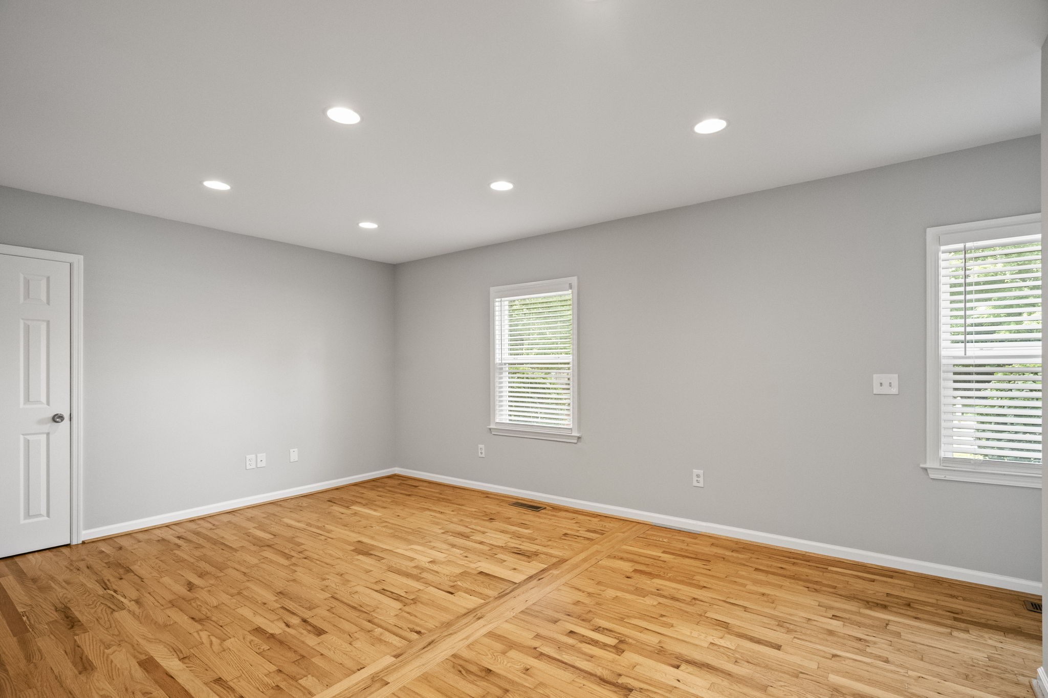 202 Cherokee Road Nashville, TN 37205 - Photo 5 of 35 a view of an empty room with wooden floor and a window