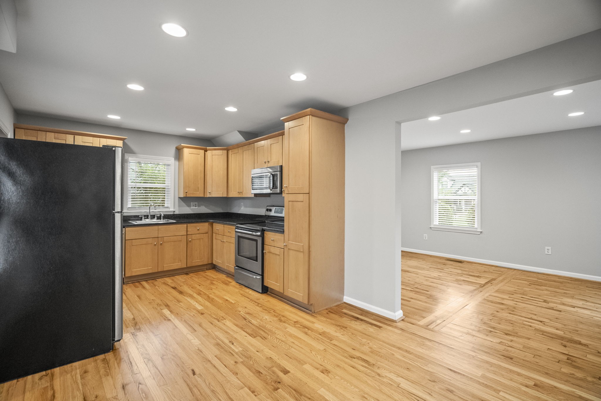 202 Cherokee Road Nashville, TN 37205 - Photo 6 of 35 a kitchen with stainless steel appliances granite countertop a refrigerator and a stove top oven