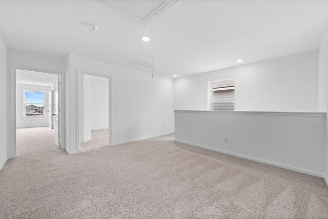 a view of an empty room with closet